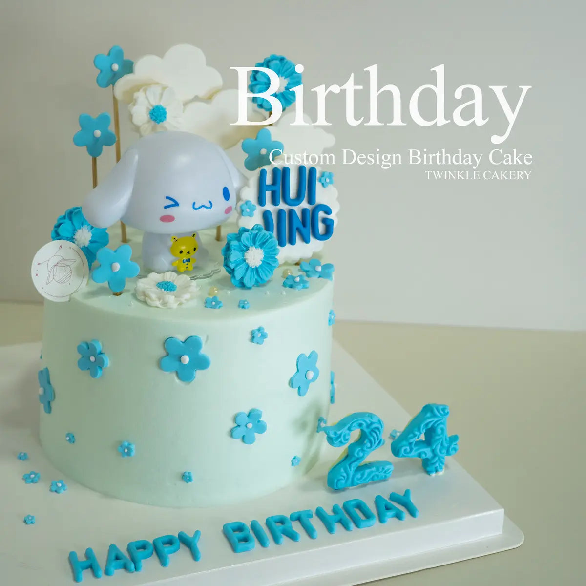 Cinnamoroll birthday cake with blue frosting and floral details - Sanrio character cake KL