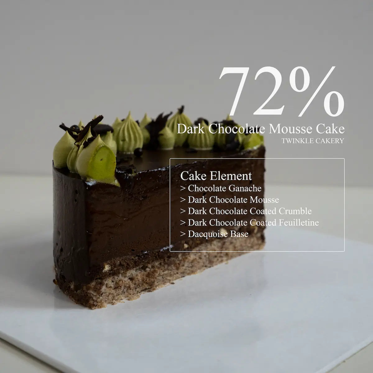 Cross section slice showing clean layers of dark chocolate mousse, crispy feuilletine, and dacquoise cake base