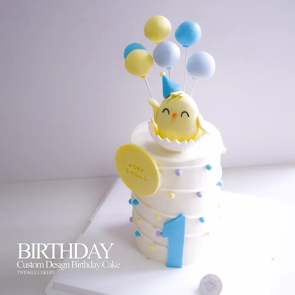 Detail of colorful fondant balloon toppers on a baby 1st birthday cake.
