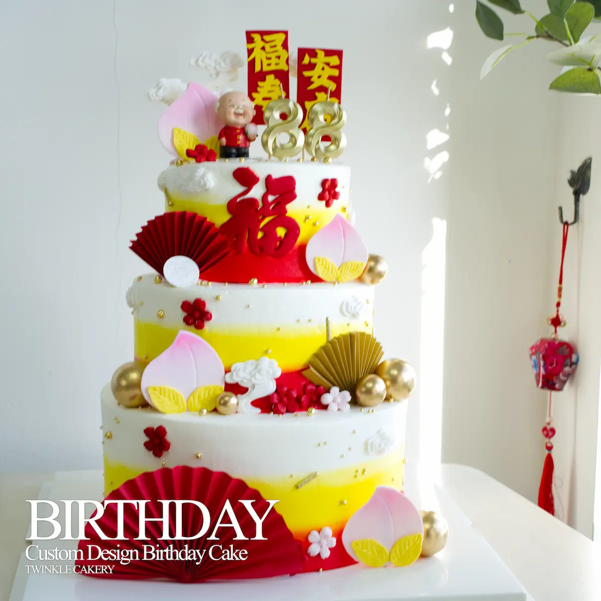 front view of 3-tier Chinese birthday cake showing red and gold prosperity colors and design details. Delivery across Selangor & Kuala Lumpur