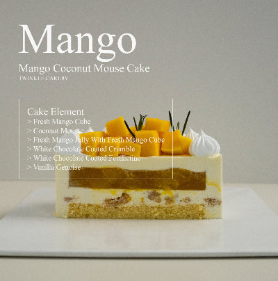 Cross section slice showing clean layers of silky mango mousse and light coconut chiffon cake base.
