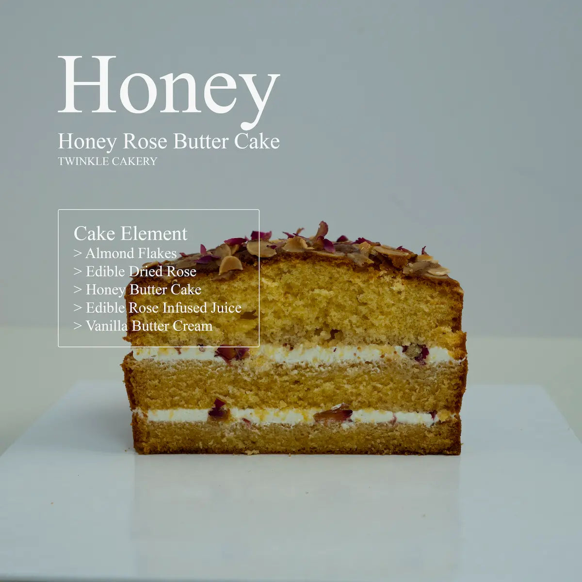 Cross section slice showing the dense moist crumb structure of a layered honey rose butter cake.