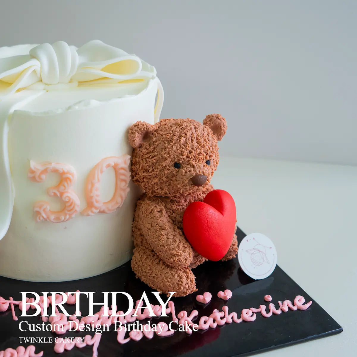 Birthday cake with a teddy bear holding a heart and personalized text on a white background - delivery across kuala lumpur