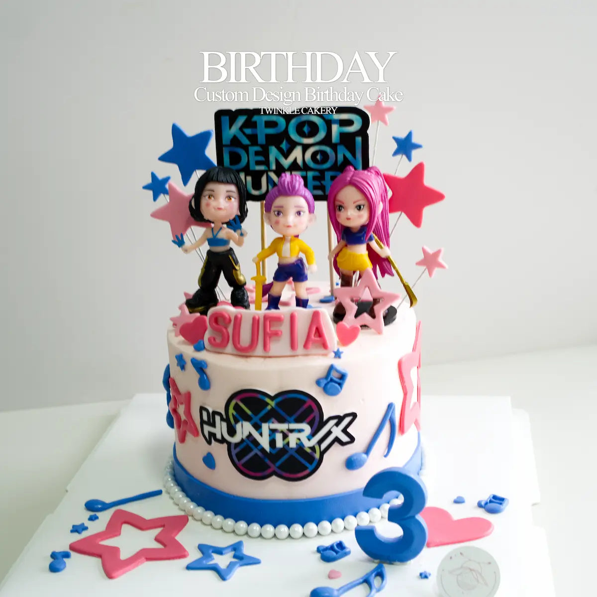 Shining cake topper on a bespoke anime-themed birthday cake for fans in Selangor.