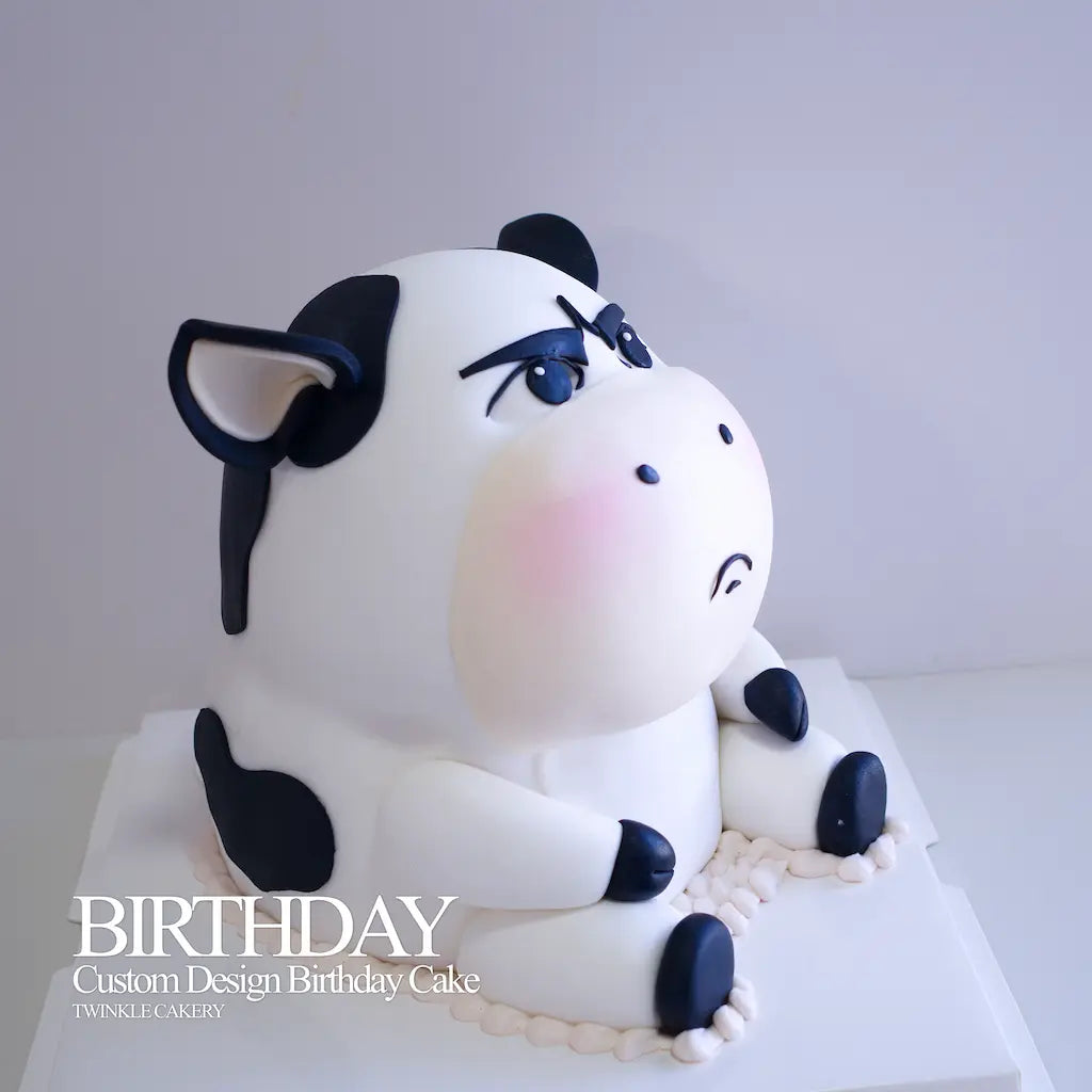 Tall 3D cow birthday cake setup on a party dessert table in Subang Jaya Selangor.