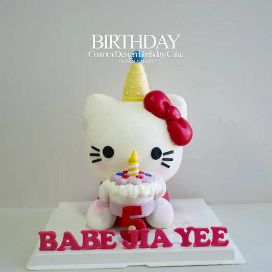 3D Hello Kitty birthday cake holding a mini cake, signature edible artistry in KL and Selangor.