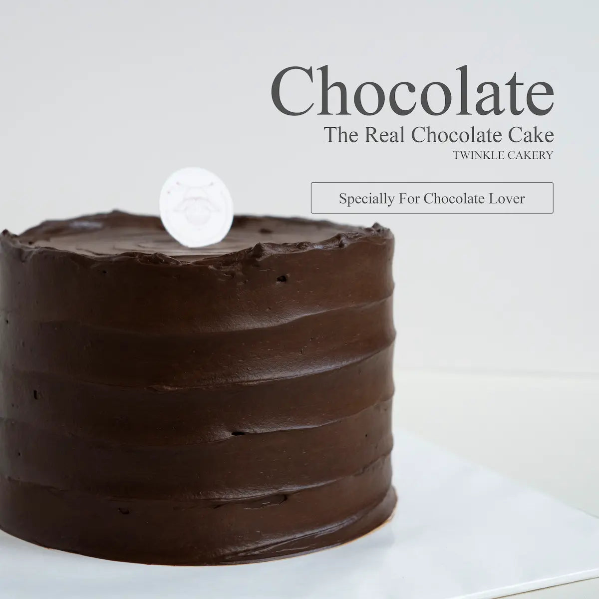 Close up texture view of rich dark chocolate ganache covering a fondant free cake in Petaling Jaya