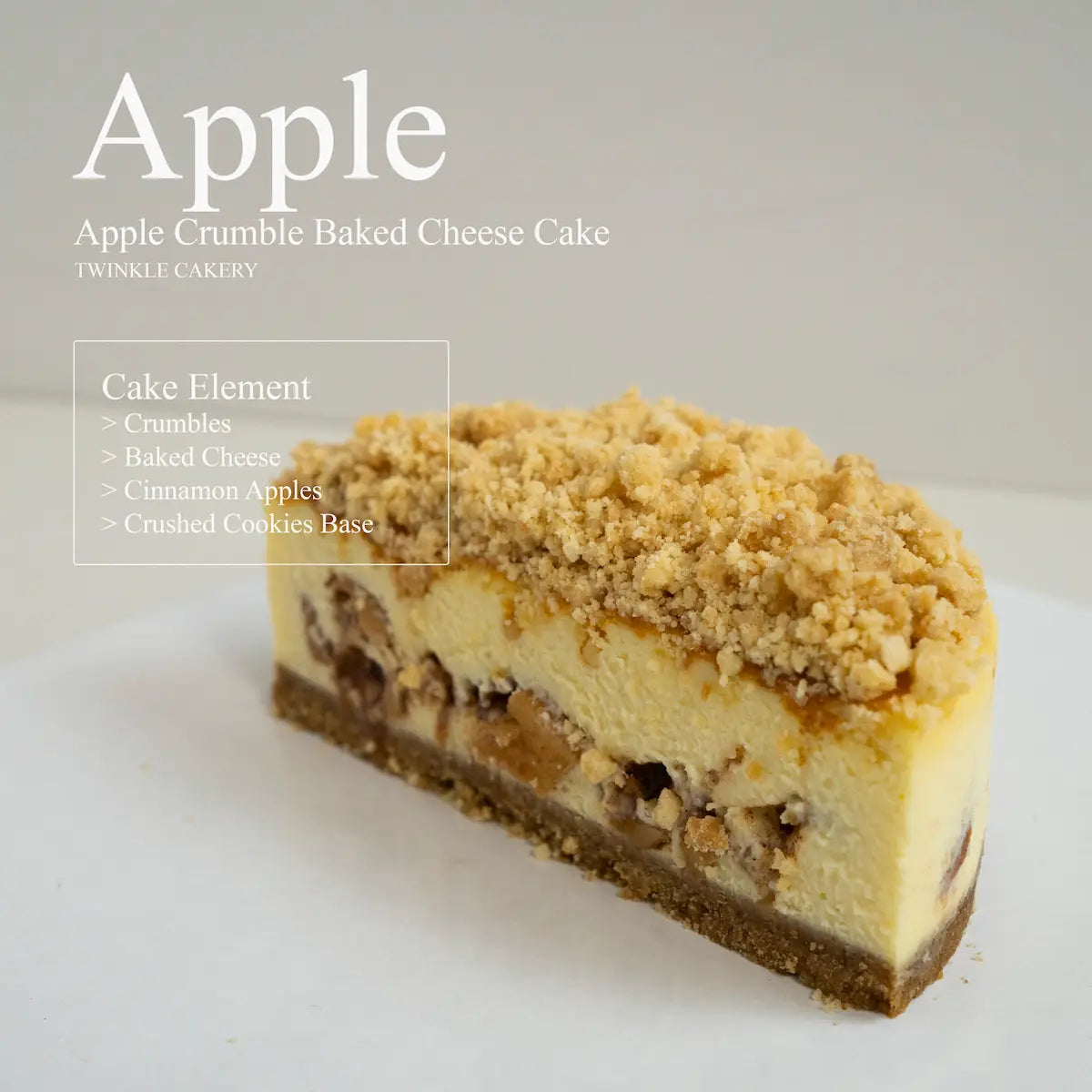 Cross section slice showing distinct layers of baked cream cheese, spiced apple cubes, and graham crust