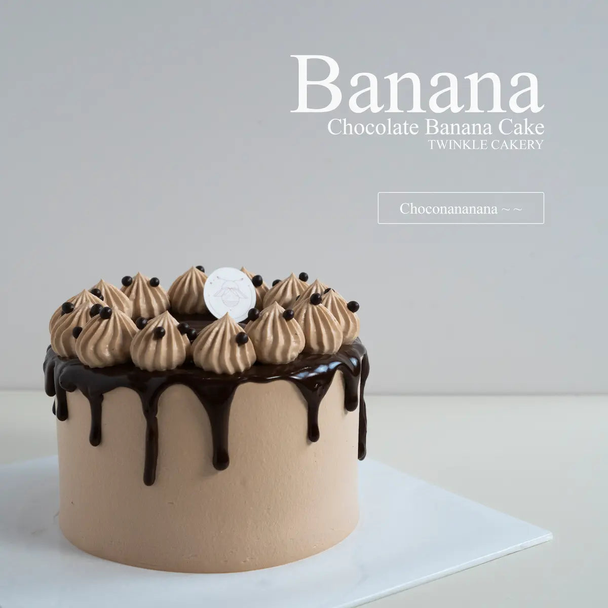 Fondant free chocolate banana drip cake with birthday candles at a celebration party in Selangor.