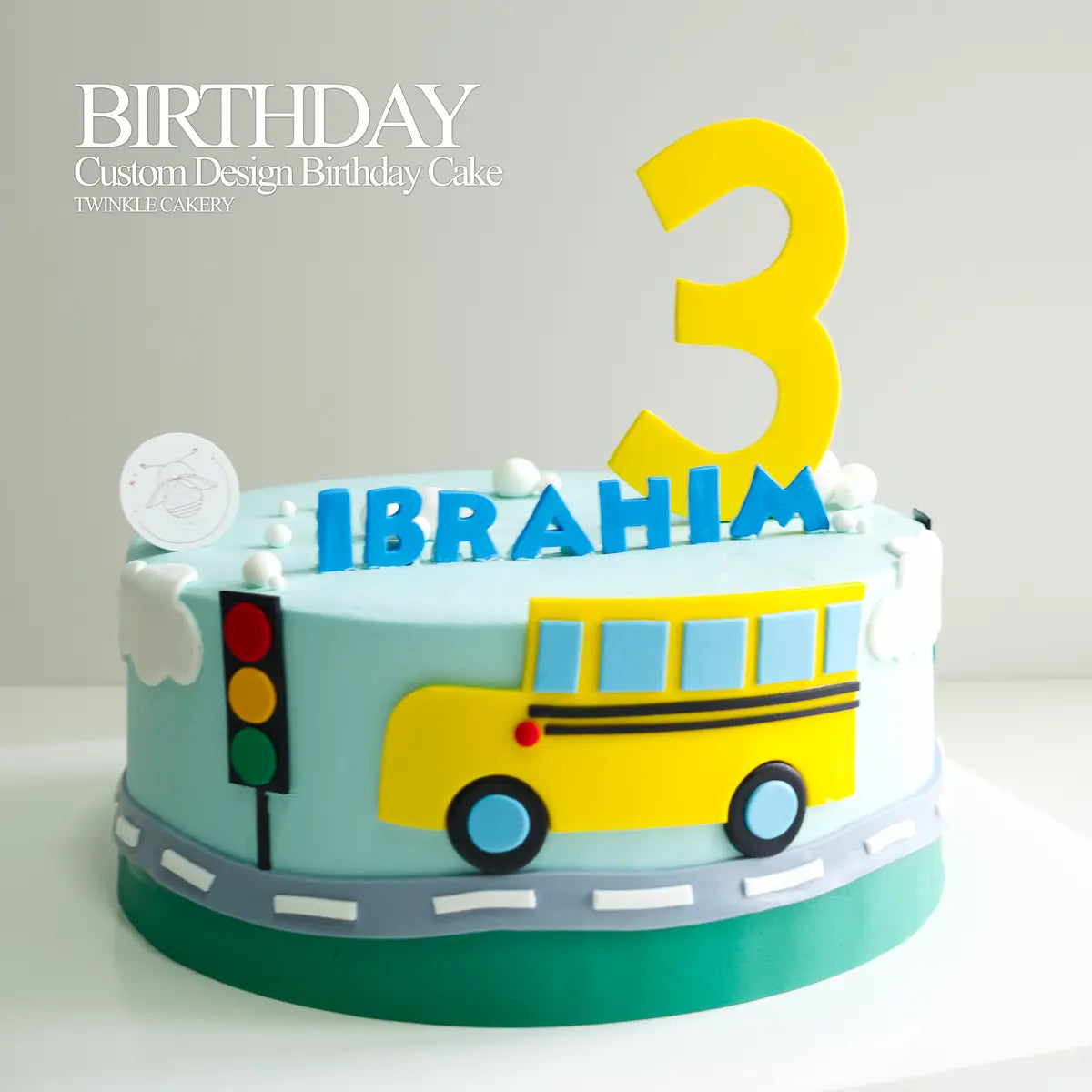 Close-up of the hand-sculpted fondant yellow bus with windows on the birthday cake. Selangor delivery.