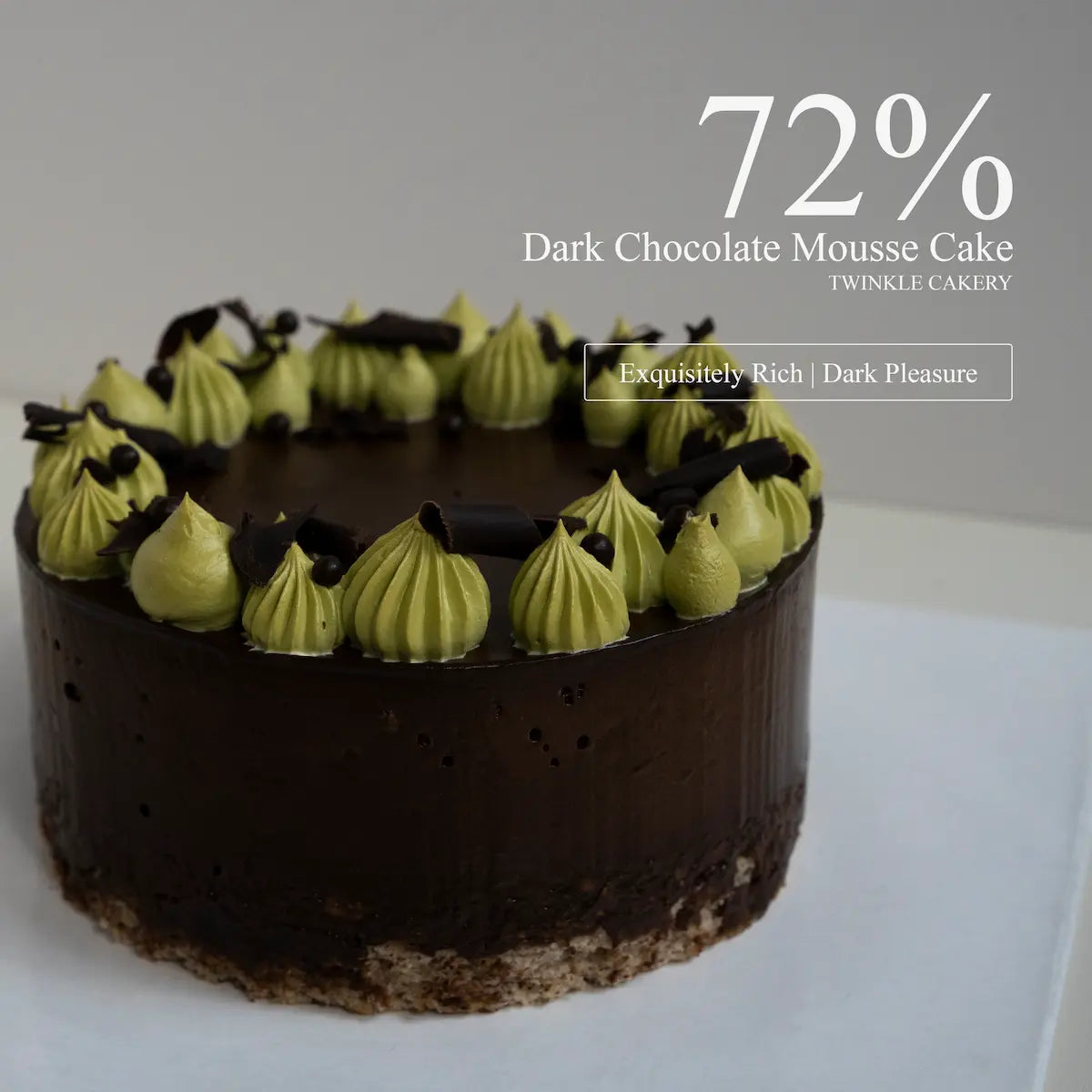 Detailed close up view of dark chocolate coated crumble and crispy feuilletine interplays inside a fondant free cake.