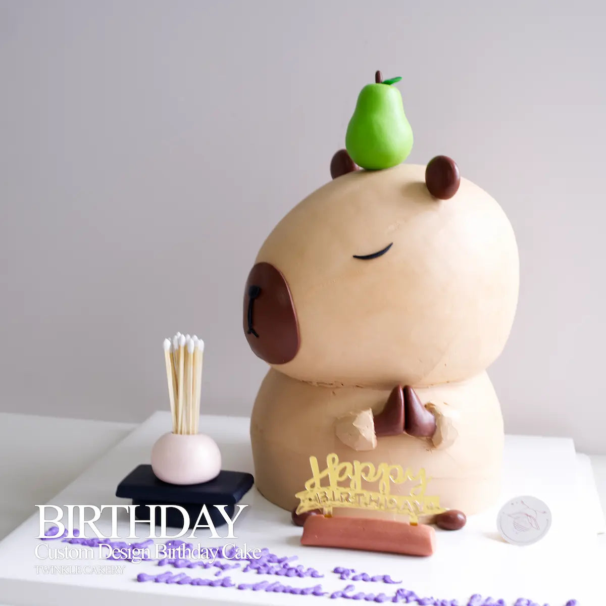 Presentation view of a custom capybara birthday cake on a serving stand, designed for event delivery in Petaling Jaya and Damansara.
