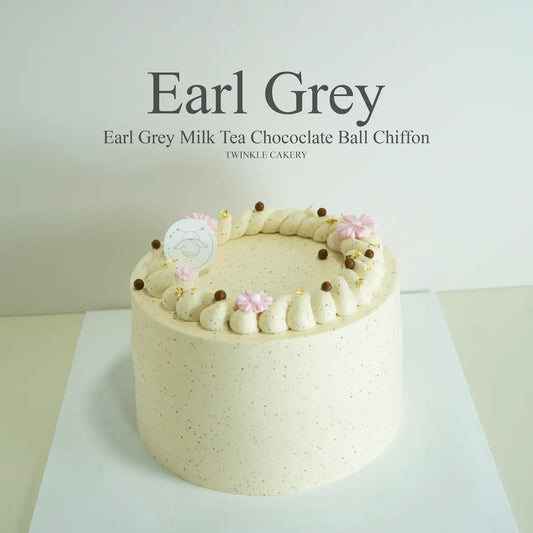Whole Earl Grey milk tea cake coated in Earl Grey fresh cream with chocolate ball topping by Twinkle Cakery