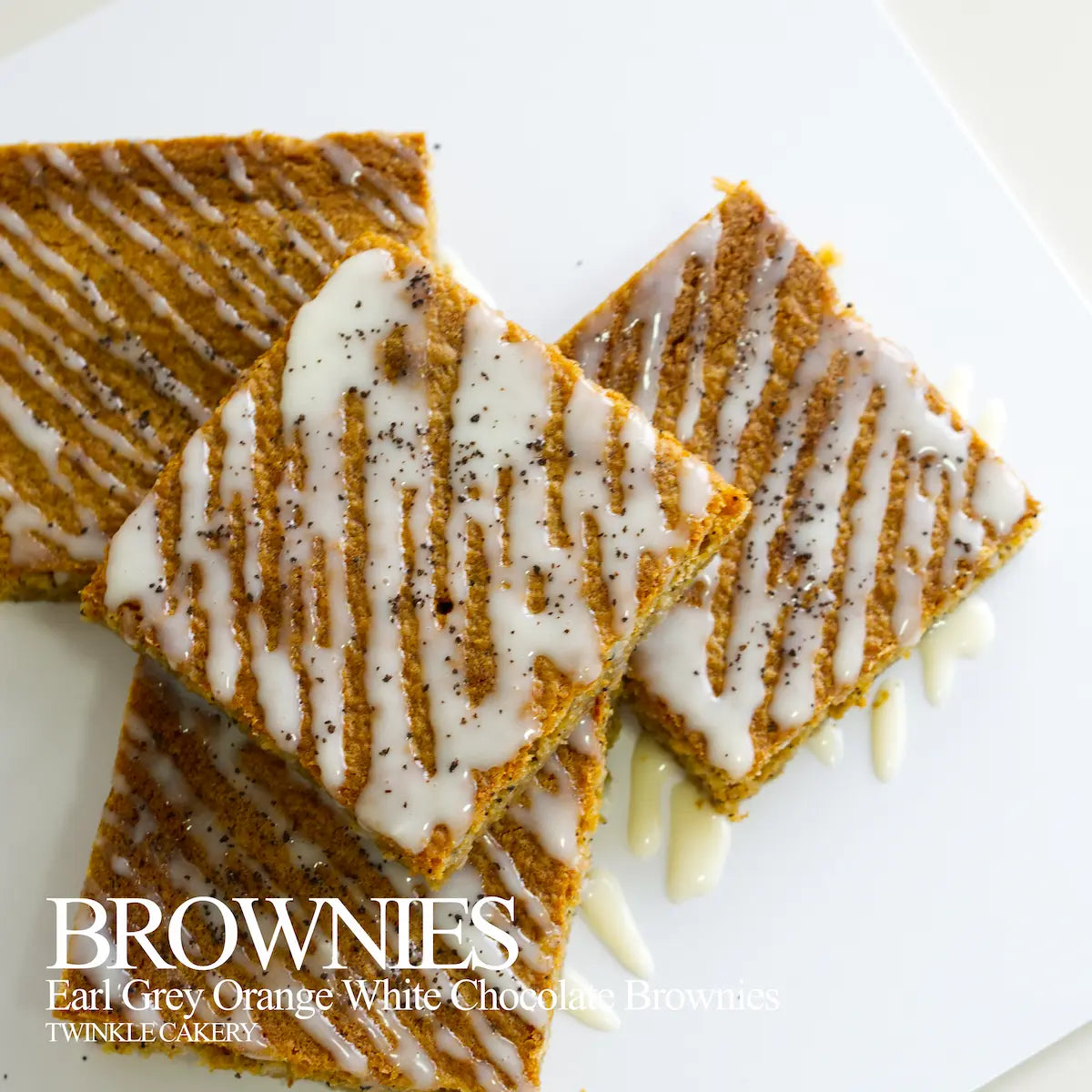 Cross-section of dense Earl Grey tea brownie showing smooth white chocolate ganache topping.