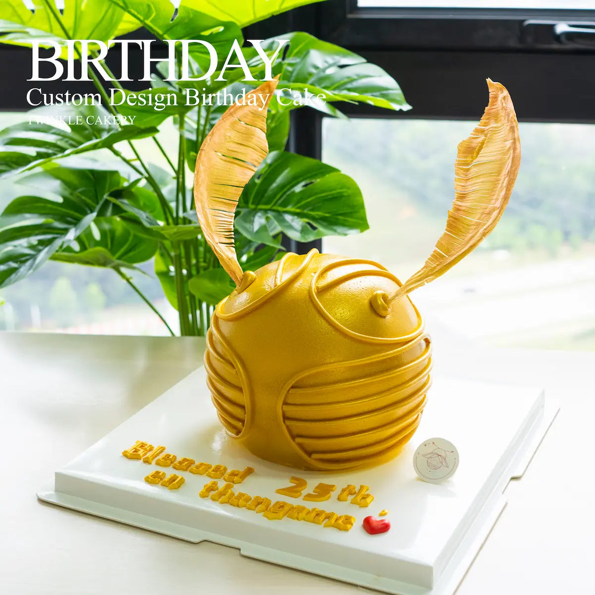 Close-up detail of the delicate wings on a Golden Snitch Harry Potter cake - custom design - Selangor Delivery