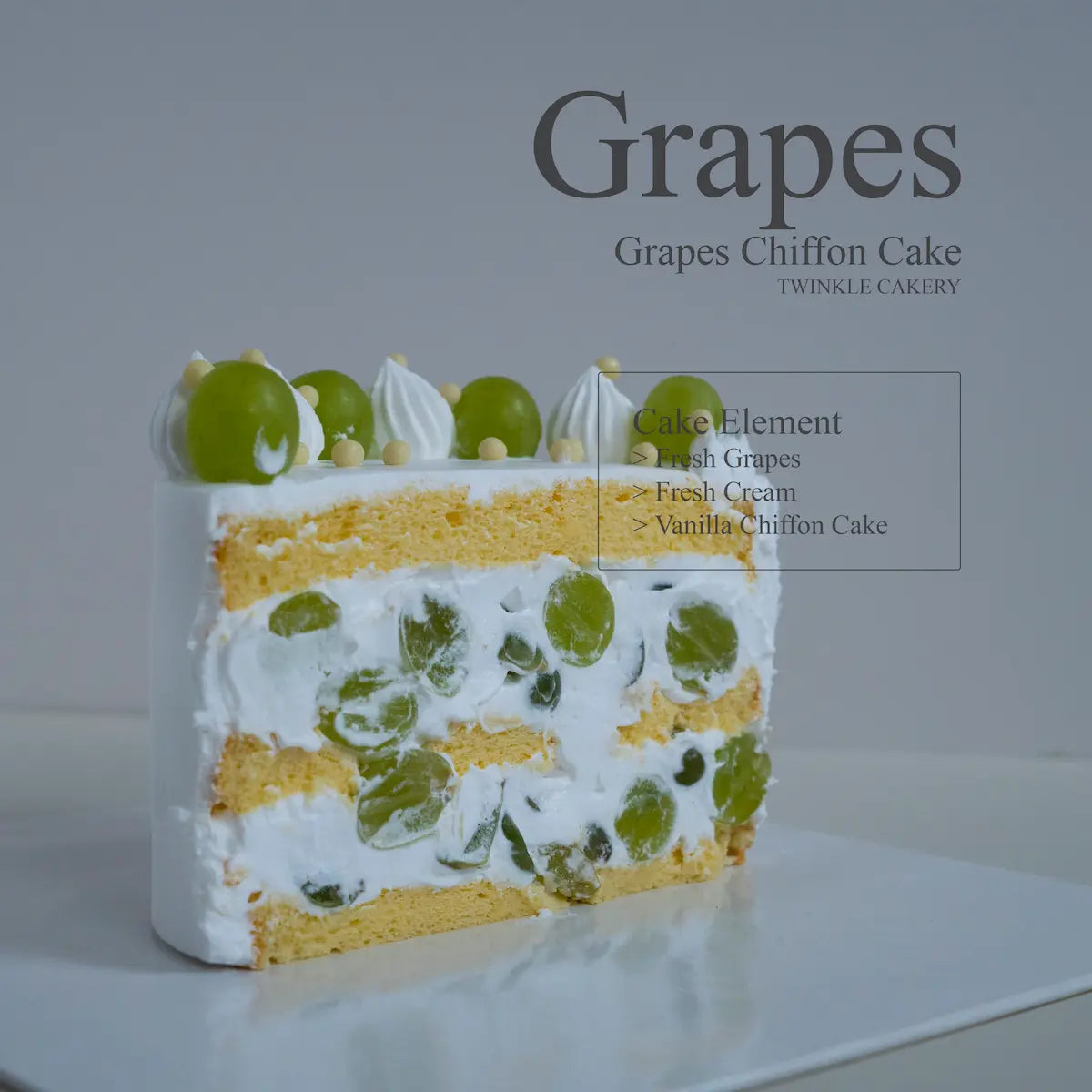 Layered cake slice profile showing fresh green grape pieces embedded in fluffy vanilla chiffon sponge.