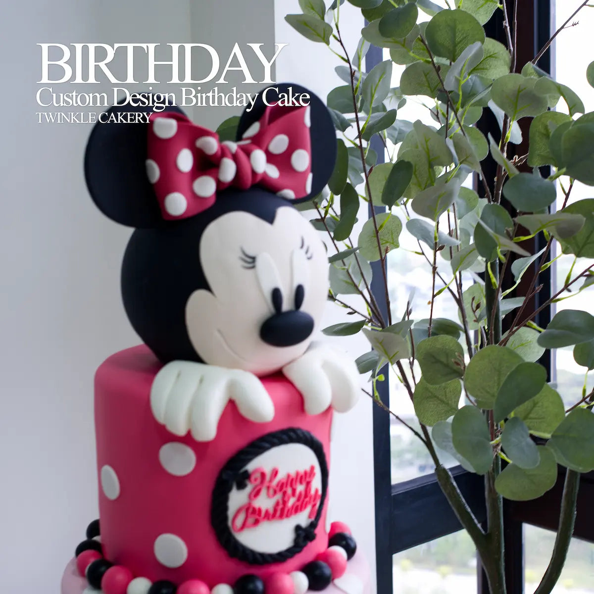 Close-up of handmade Minnie Mouse fondant topper with bow details - Selangor