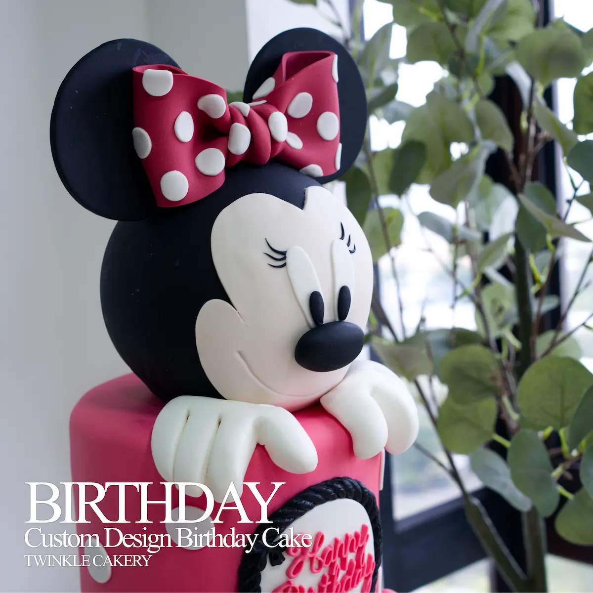 Close-up of handmade Minnie Mouse fondant topper with ribbon details - Kuala Lumpur