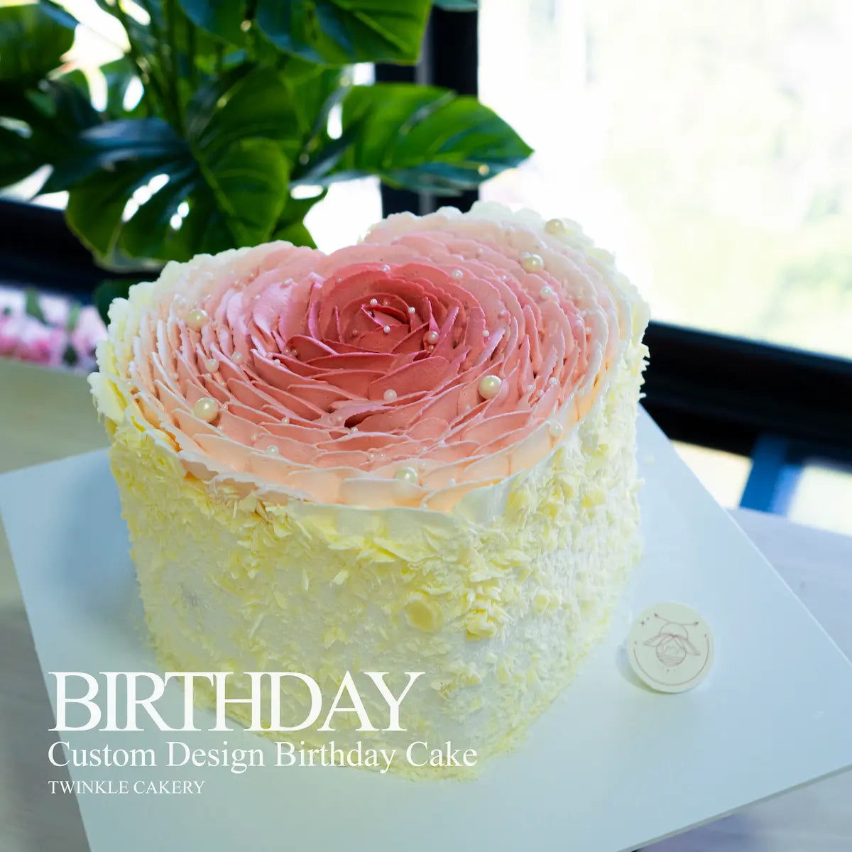 Close-up of hand-piped fresh cream rose petals on a heart shaped cake - Kuala Lumpur