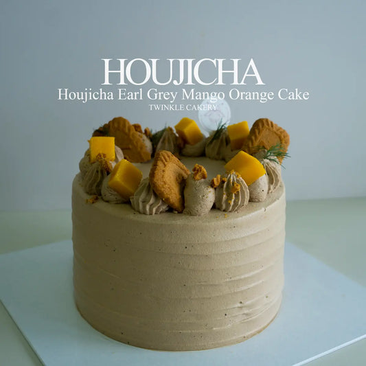 Houjicha Earl Grey mango orange cake frosted in houjicha fresh cream with fresh mango topping by Twinkle Cakery.