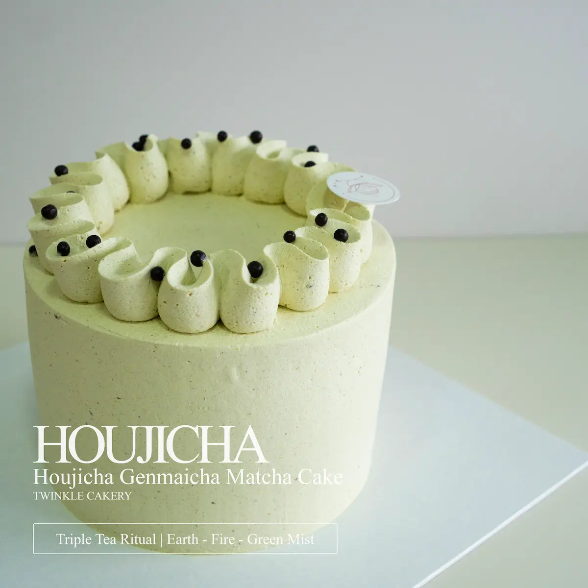 A slice of soft houjicha chiffon cake with matcha panna cotta filling on a ceramic plate.