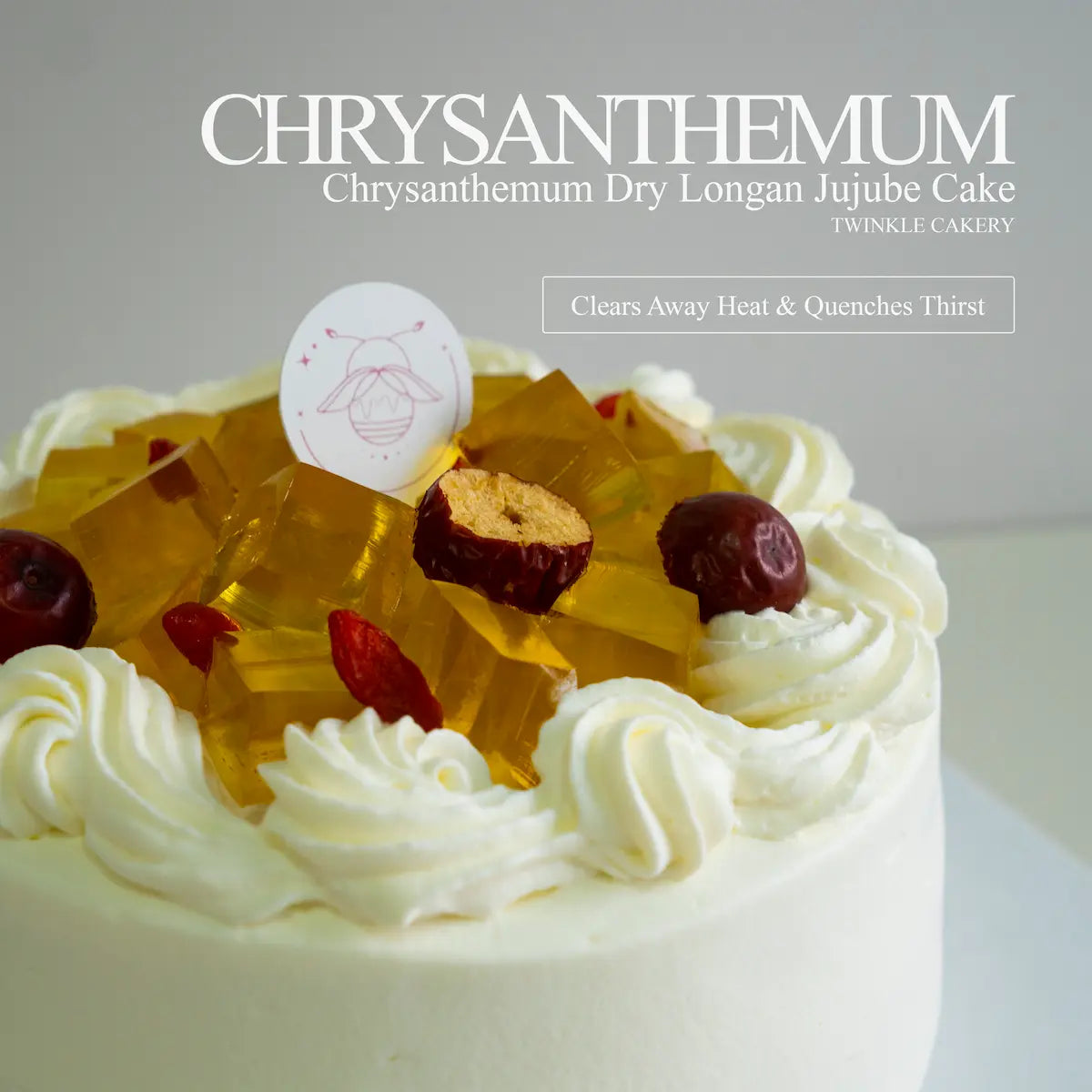 Detailed close-up of translucent golden chrysanthemum jelly cubes arranged on smooth white fresh cream.