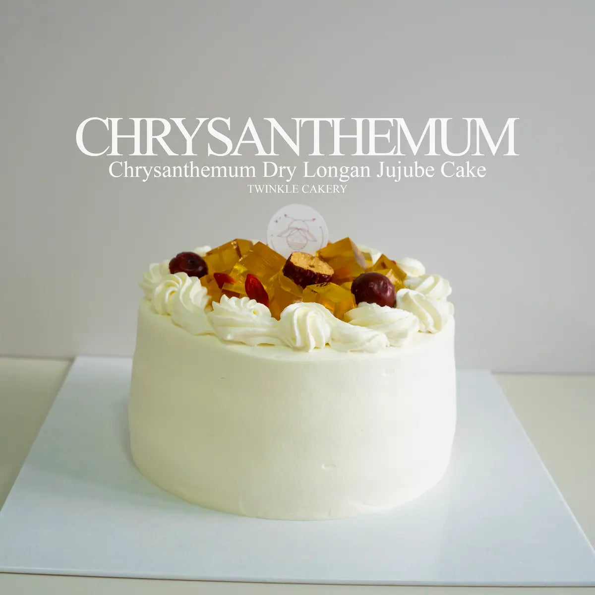 Whole fresh cream chrysanthemum cake topped with herbal jelly cubes on a jujube chiffon base by Twinkle Cakery.