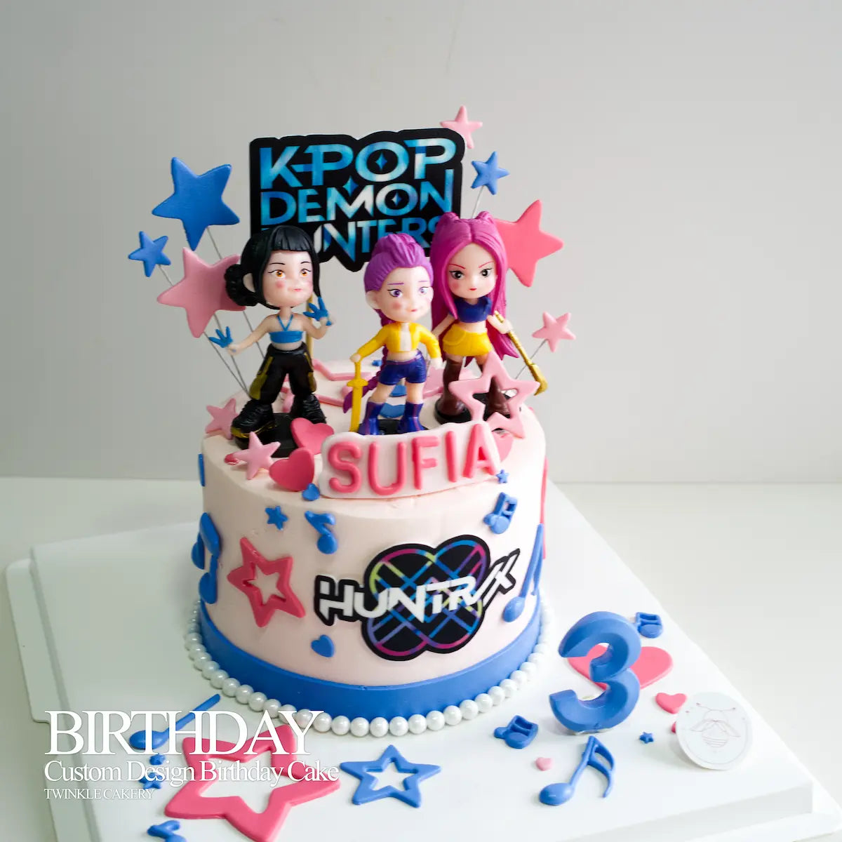 Custom K-Pop Demon Hunters anime birthday cake with Rumi, Mira, and Zoey toppers in KL and Selangor