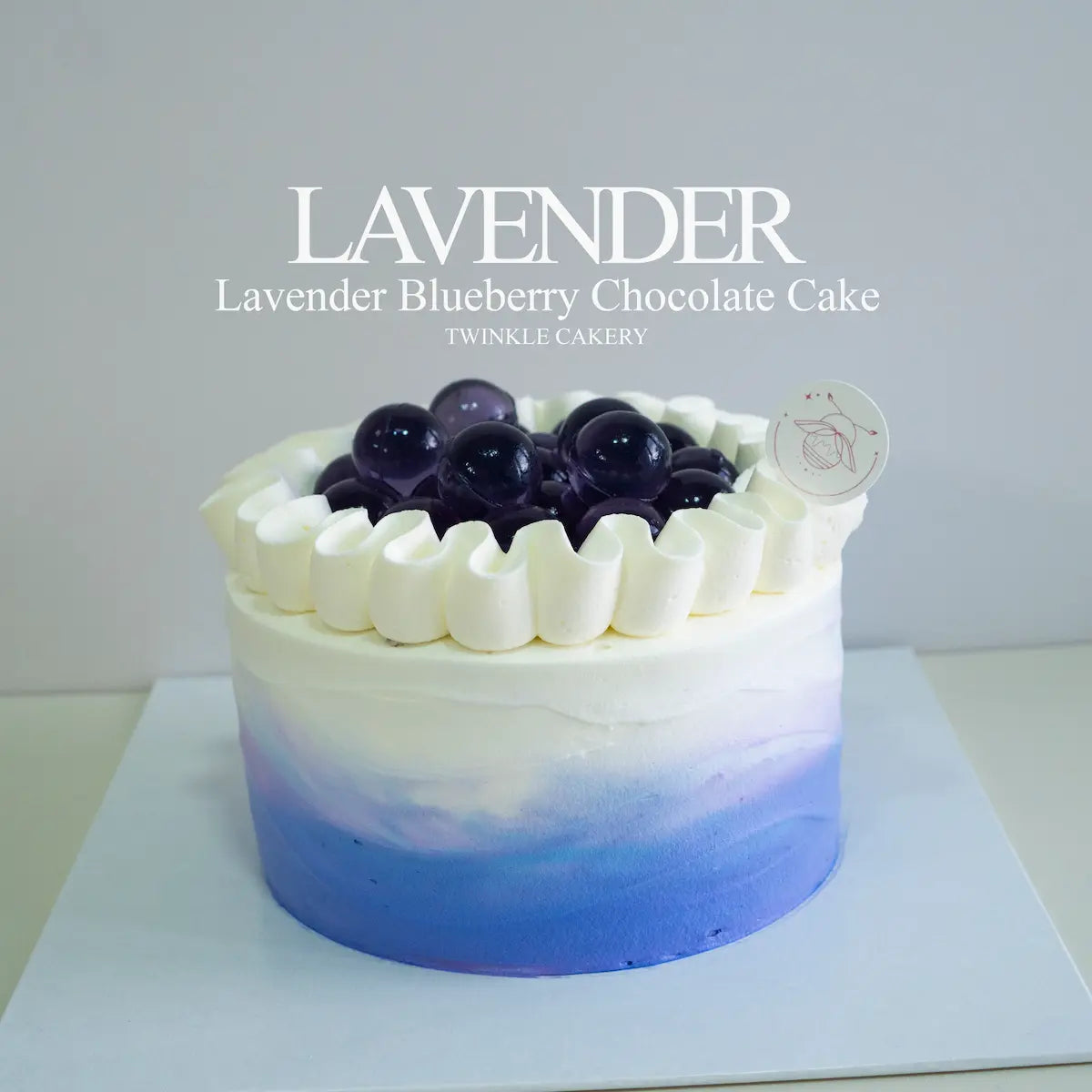 Lavender blueberry chocolate chiffon cake topped with fresh cream and lavender jelly balls by Twinkle Cakery.