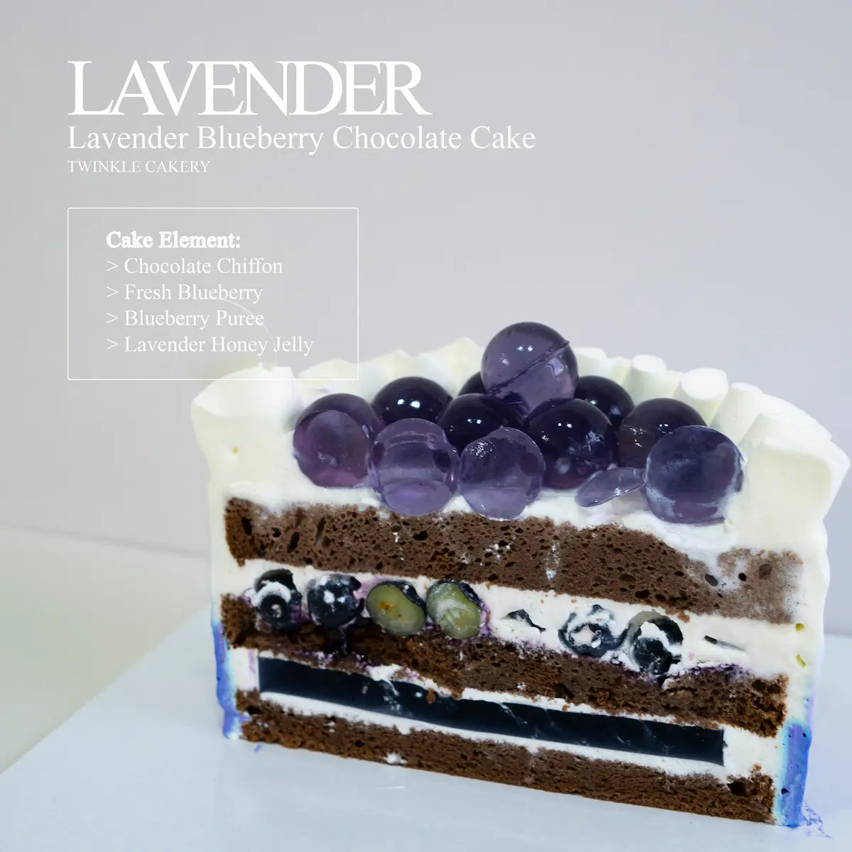 Cake slice showing chocolate chiffon, two lavender jelly layers, fresh blueberries, and fresh cream