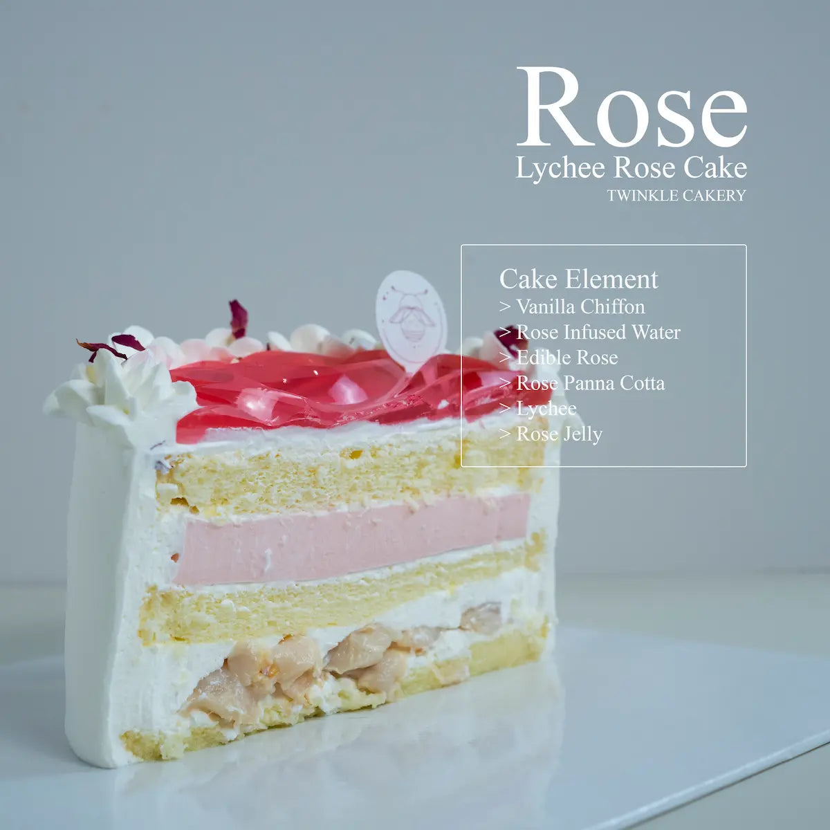 Internal slice profile showing real lychee fruit pieces layered within rose chiffon cake.
