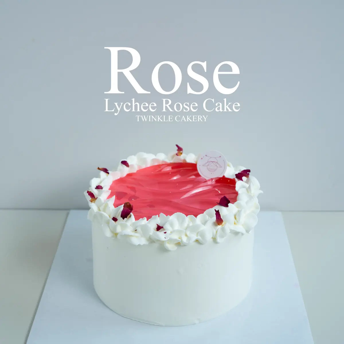 Whole lychee rose chiffon cake with fresh cream finish and glossy rose jelly top by Twinkle Cakery.