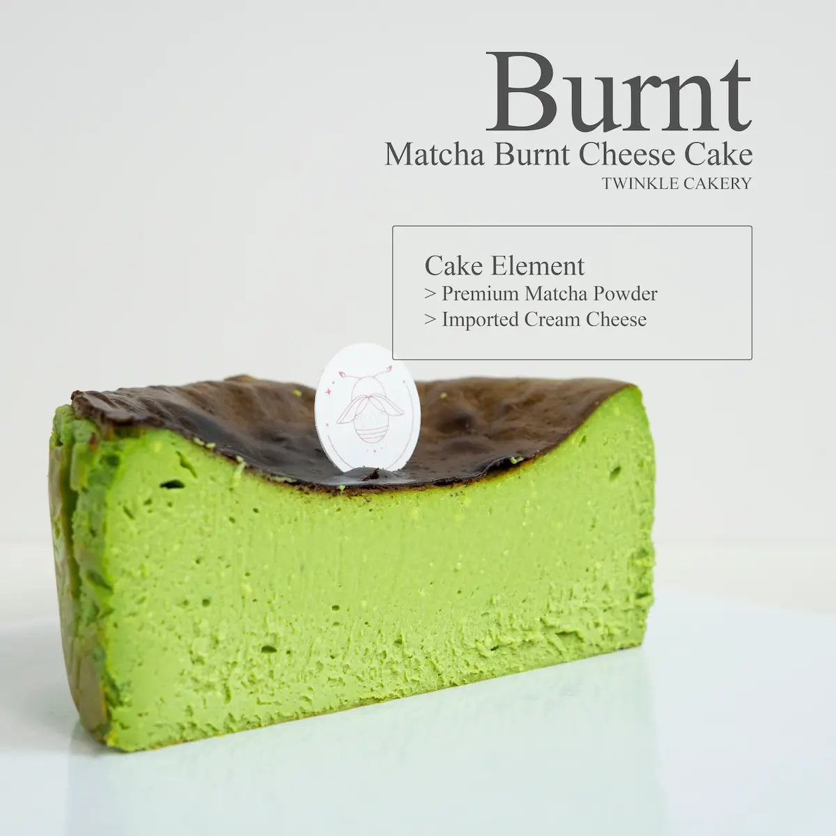 Cross section slice showing the velvety green baked cream cheese interior of a matcha burnt cheesecake.