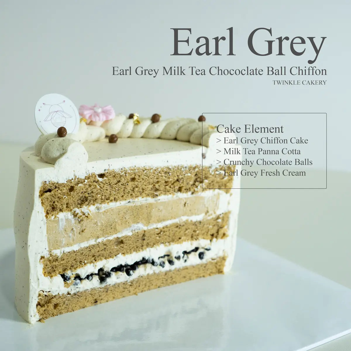 Internal slice showing layers of silky milk tea panna cotta and chocolate crunchy balls inside Earl Grey chiffon.