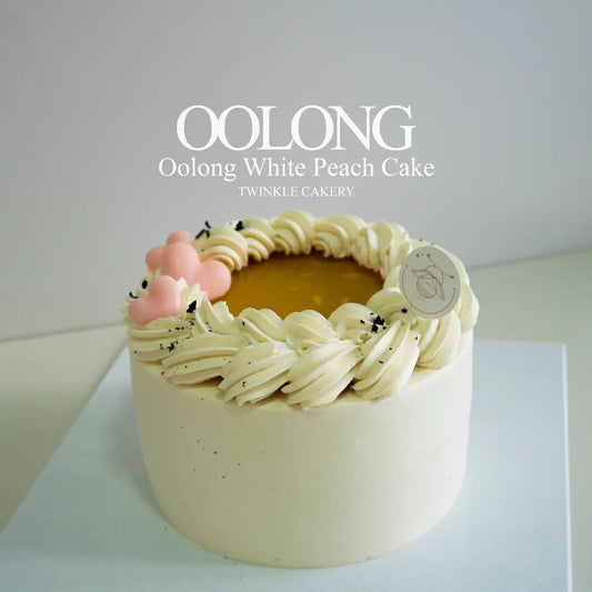 Oolong white peach chiffon cake frosted in oolong fresh cream topped with oolong tea jelly by Twinkle Cakery.
