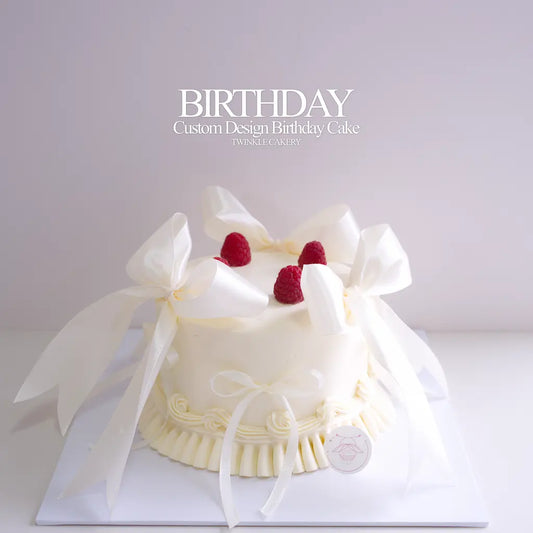 Minimalist romantic white birthday cake topped with 4 red raspberries and white ribbon by Twinkle Cakery KL and Selangor