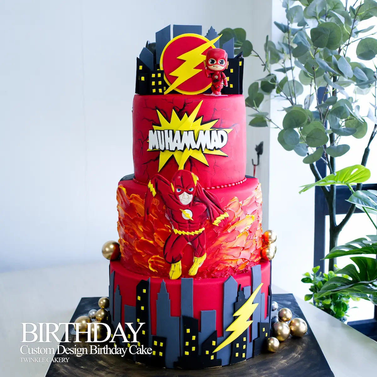 Vibrant Flash themed side of a 3-tier cake featuring red fire effects and lightning logos in Puchong.