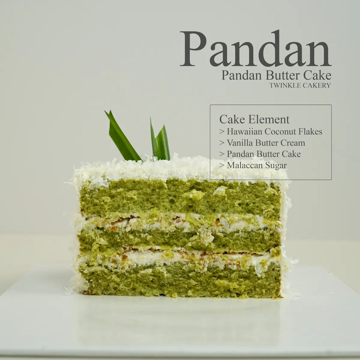 Sliced pandan coconut cake with authentic gula melaka arranged neatly on a wooden serving platter, ideal for corporate high tea or cafe dessert supply in Petaling Jaya and Puchong.