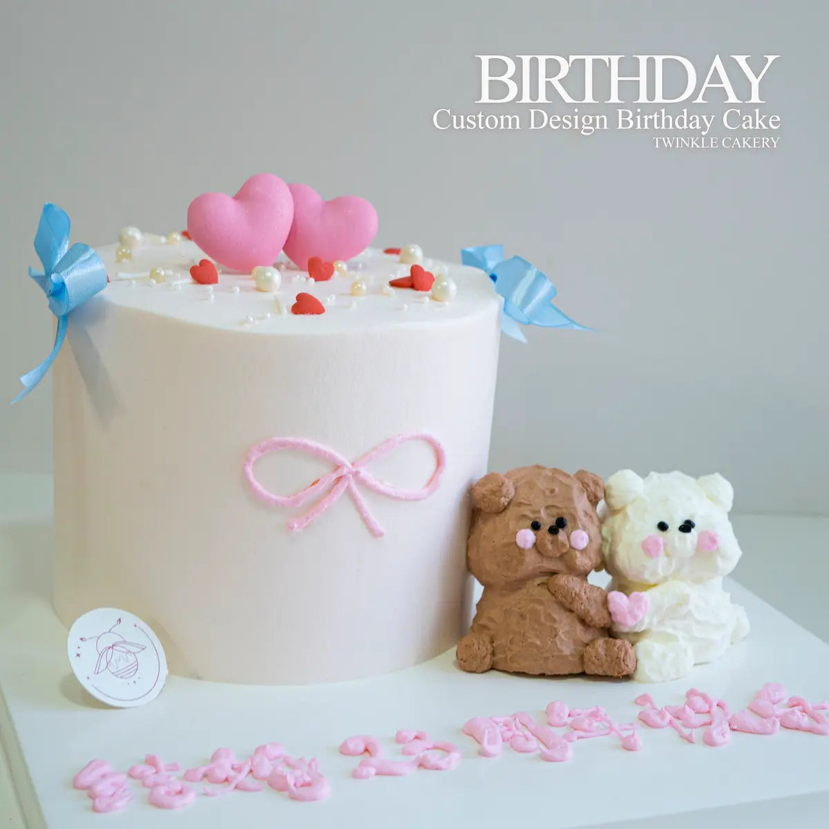 Close-up of two cute bears hugging on romantic birthday cake - Kuala Lumpur