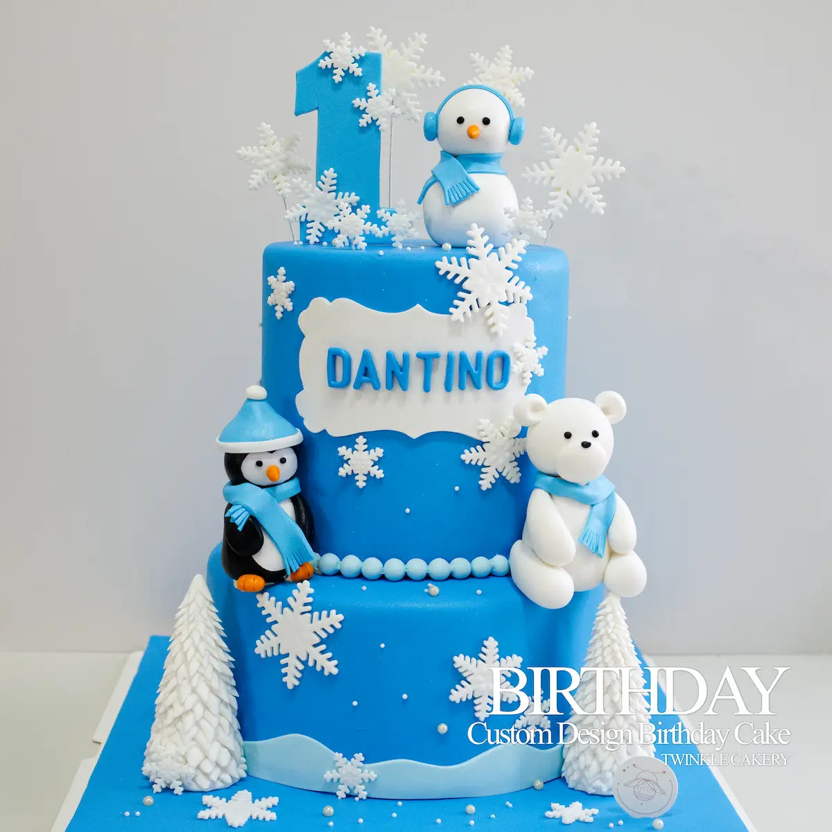 2-tier Winter Wonderland themed birthday cake in blue with handmade fondant snow in KL and Selangor