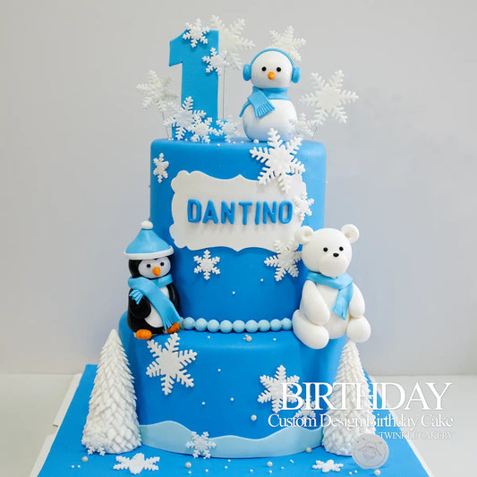 2-tier Winter Wonderland themed birthday cake in blue with handmade fondant snow in KL and Selangor