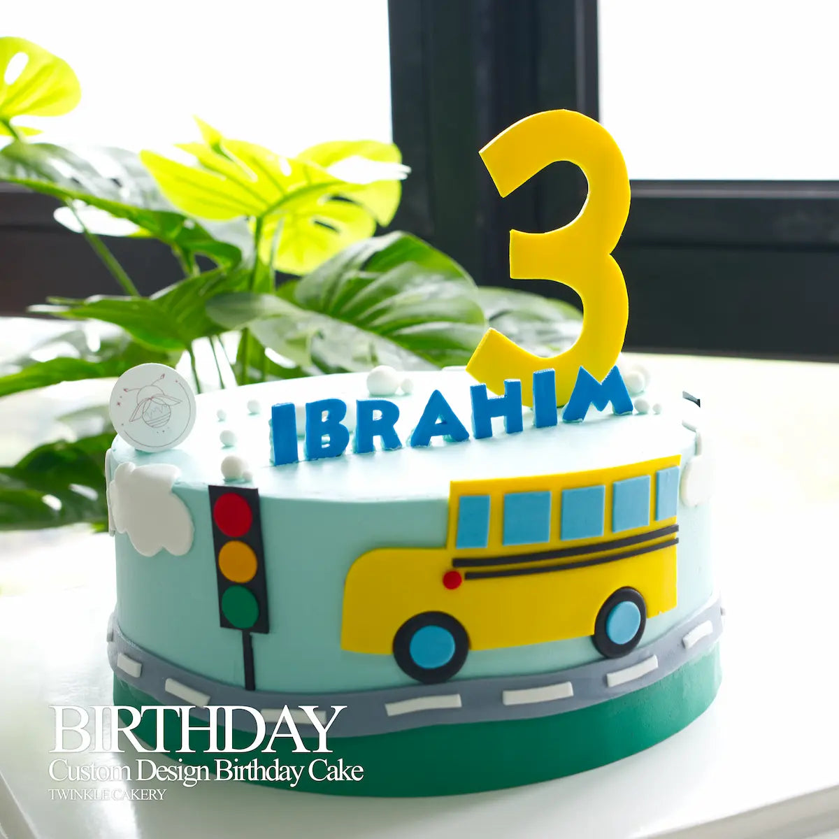 Yellow Bus birthday cake as the centerpiece on a kids' party table.