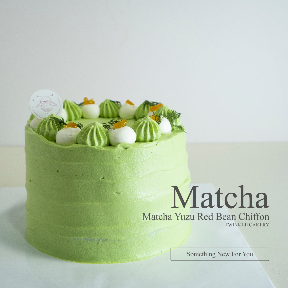 Close-up of smooth matcha fresh cream frosting and delicate Japanese green tea accents.